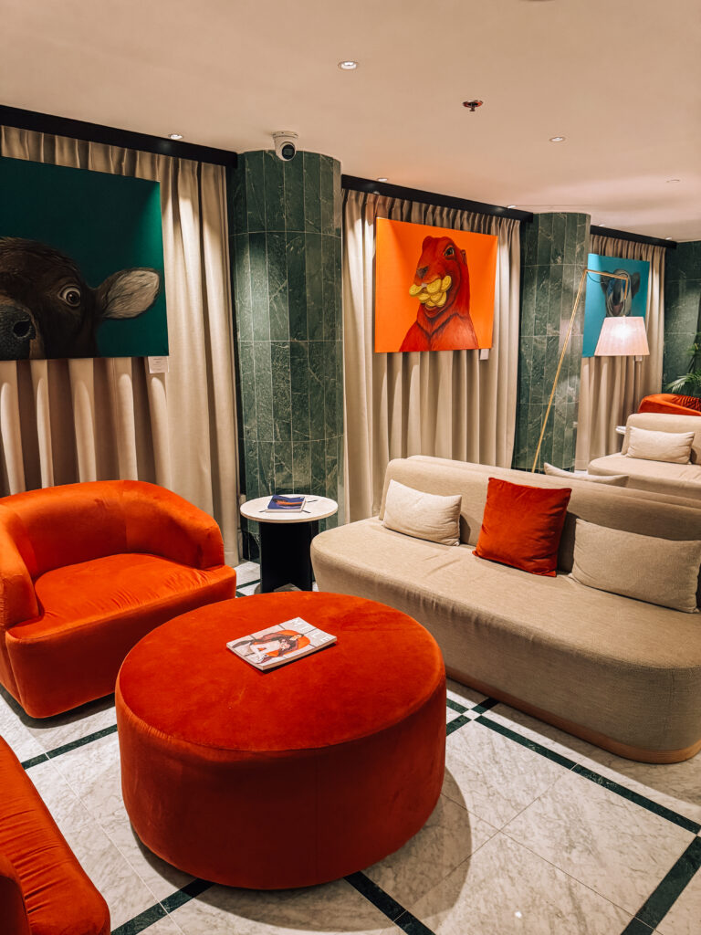 cozy lobby of Almanac X Alcron Prague Hotel featuring local artwork in a hotel review of Almanac X Alcron, one of best hotels to stay in Prague