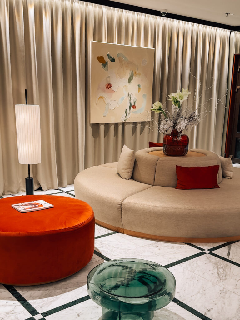 cozy lobby of Almanac X Alcron Prague Hotel featuring local artwork in a hotel review of Almanac X Alcron, one of best hotels to stay in Prague