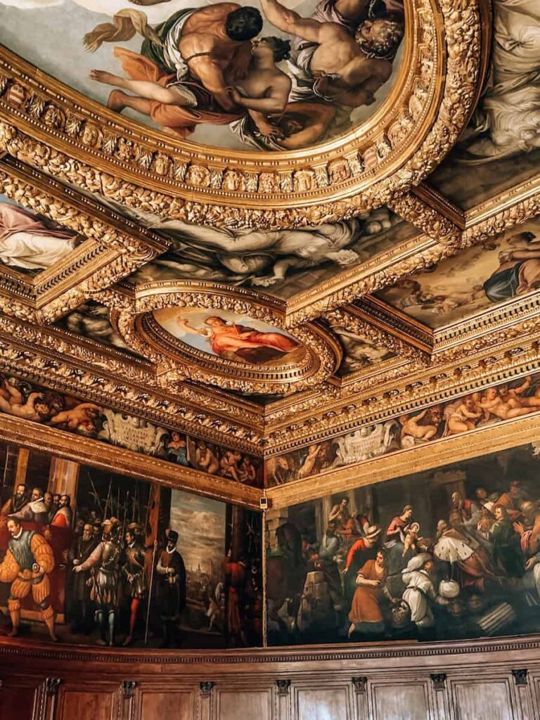 A detailed view of the richly decorated ceilings and historic frescoes inside the Doge’s Palace in Venice.