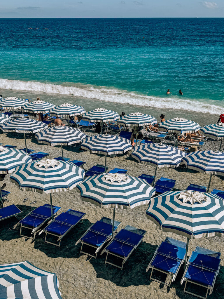Iconic blue striped umbrellas of Cinque Terre at Monterosso
