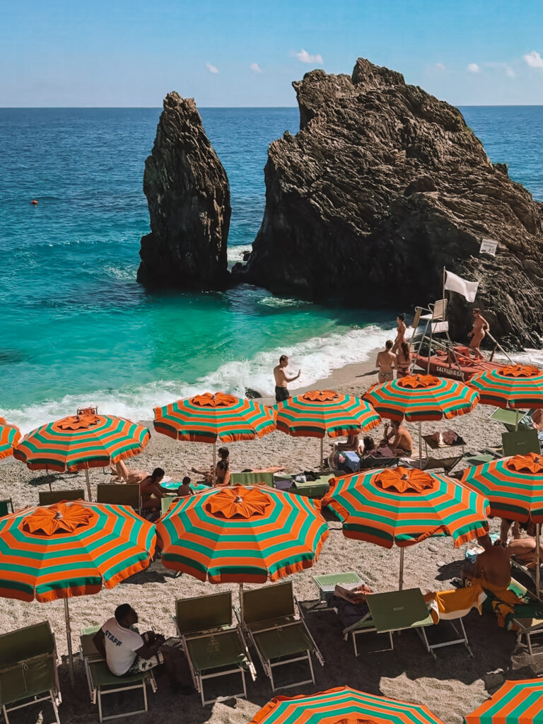 Iconic orange umbrellas of Cinque Terre at Monterosso