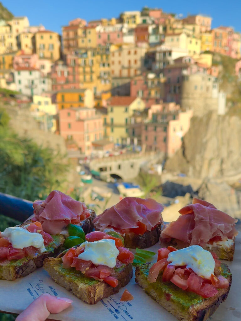 Nessun Dorma, bruschetta with fresh pesto and tomatoes with views of Manarola, Cinque Terre, Italy