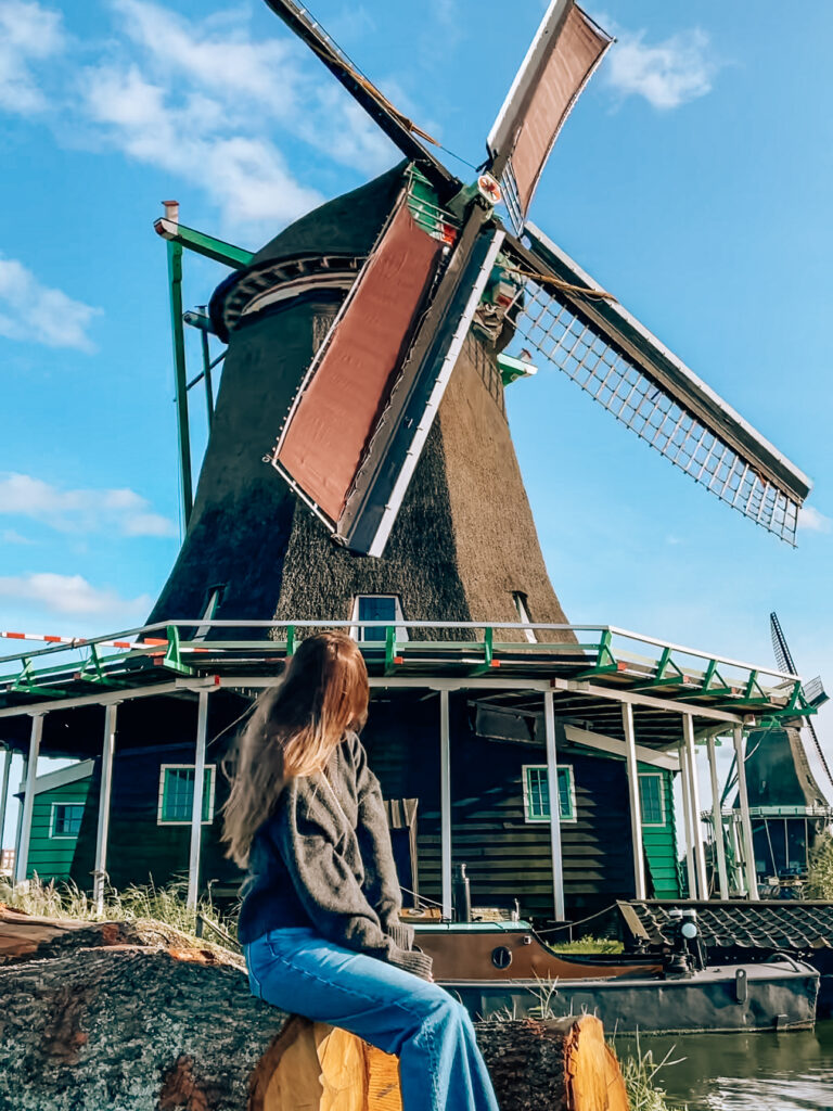 Traditional Dutch windmills at Zaanse Schans on a sunny day – a perfect day trip from Amsterdam