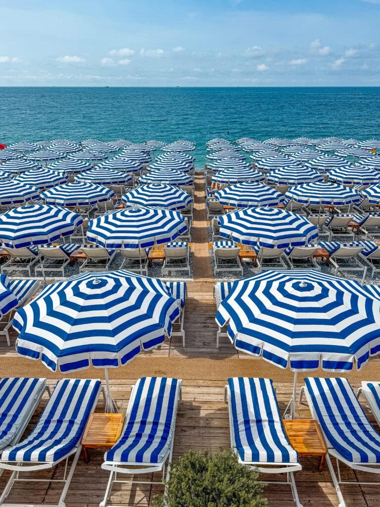 iconic blue and white stripe umbrellas at Ruhl Plage beach club in Nice