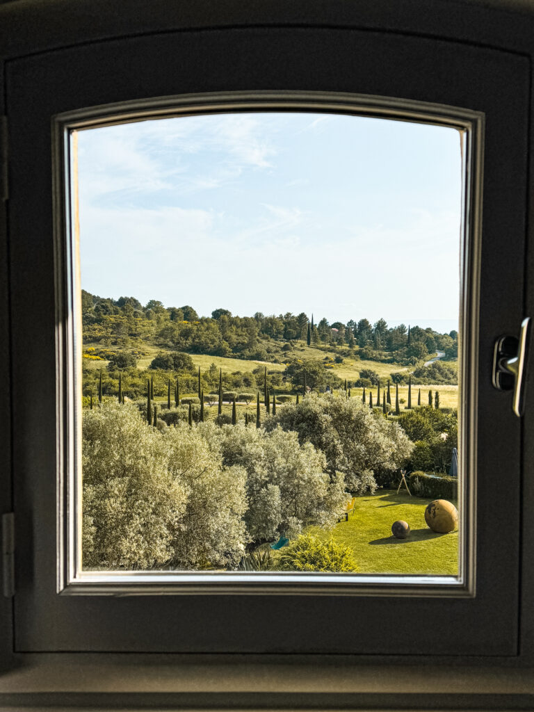 window with views of peaceful greenery in provence