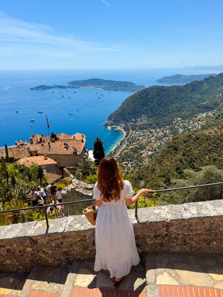 a woman enjoying views of exotic plants and the Mediterranean Sea from jardin exotique d'Eze in Eze Village France