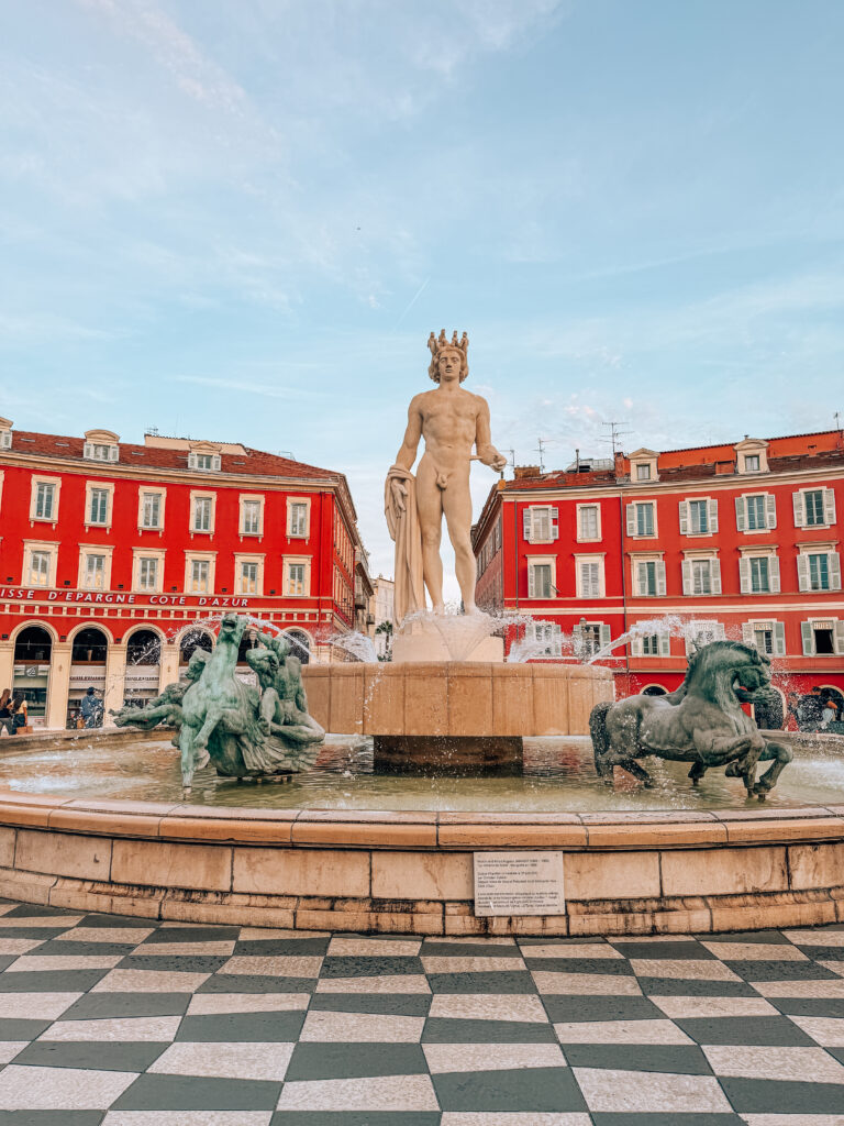 Place Massena in Nice with Apollo statue and red buildings in the background