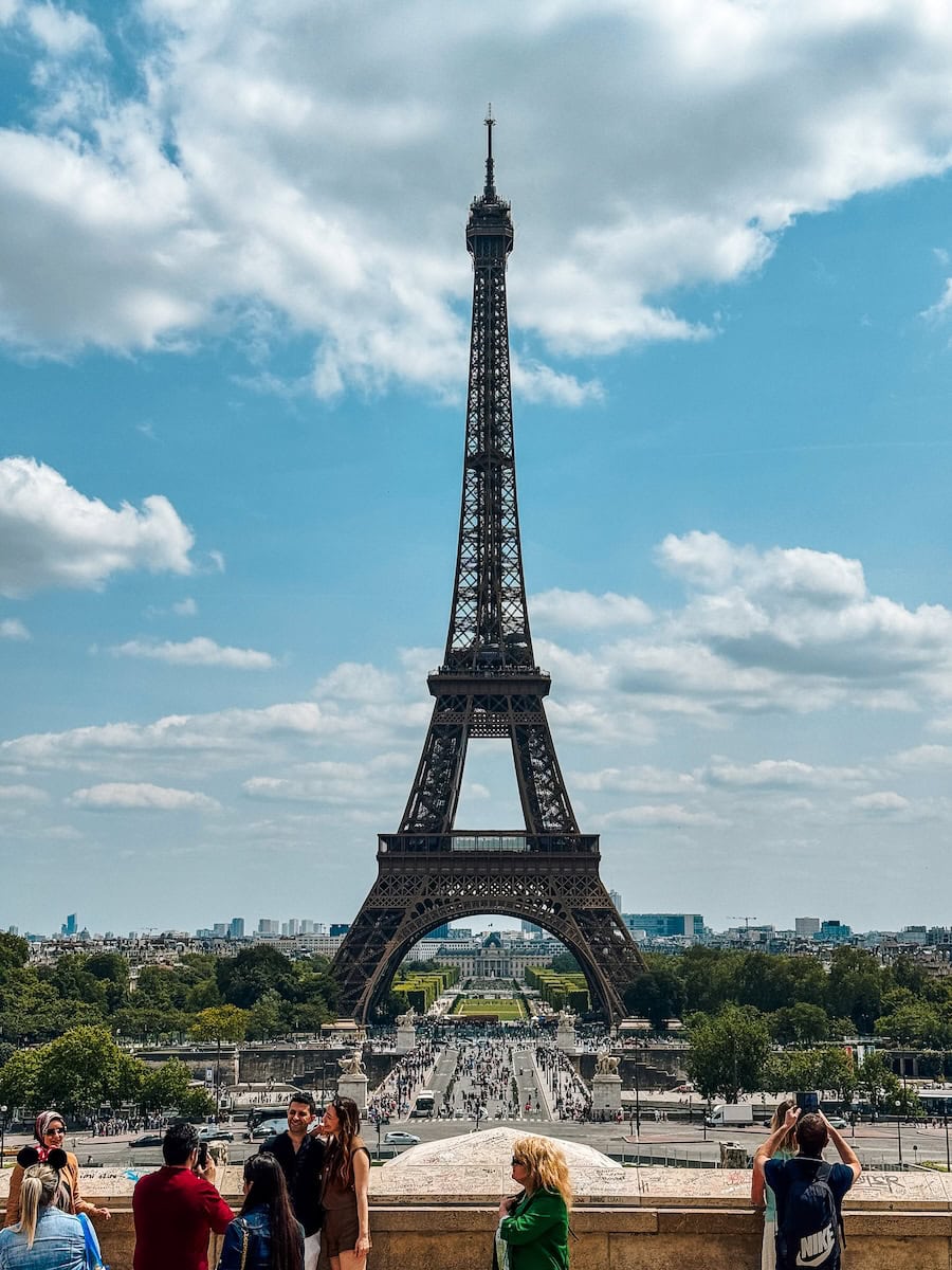 Capturing the Eiffel Tower from Trocadéro, one of the best things to do in Paris, where travelers gather for the perfect panoramic view of this iconic landmark under a bright blue sky.

