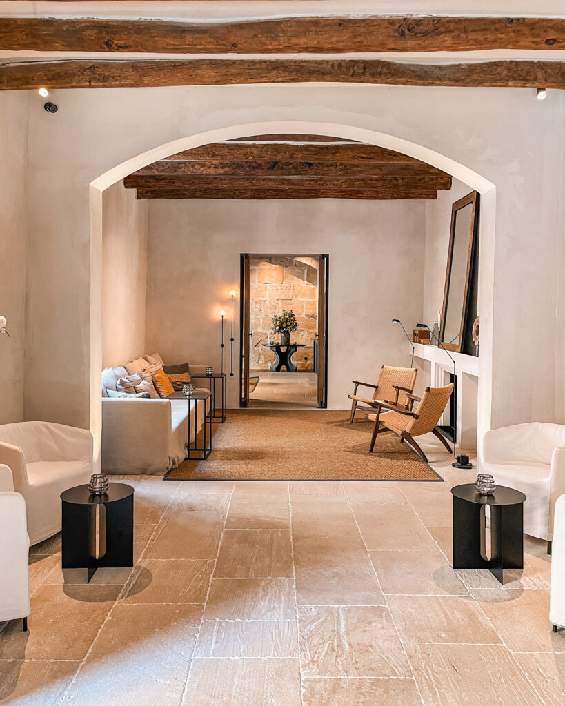 Elegant lobby of Can Ferrereta hotel in Mallorca featuring neutral toned furniture 