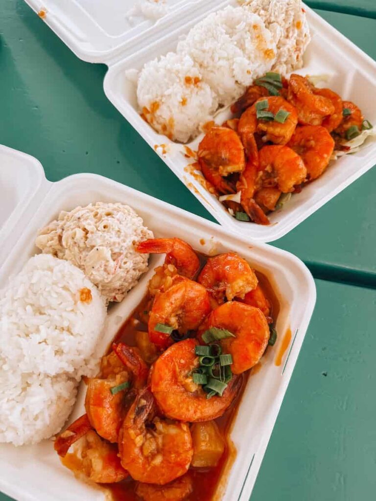 Hawaiian plate lunch from Geste Shrimp Truck in Maui with garlic shrimp, rice, and macaroni salad served in a takeout box