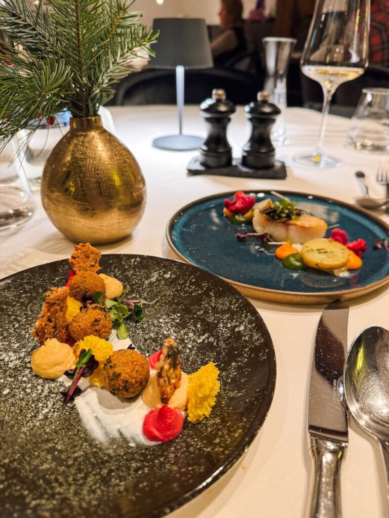 Fine dining dishes at Hotel Krallerhof restaurant with seasonal ingredients and artistic presentation
