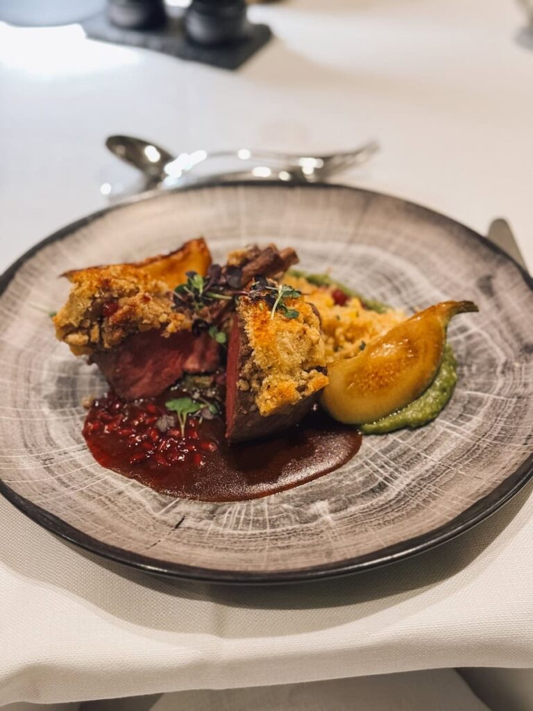 Elegant plated dinner at Hotel Krallerhof featuring modern Austrian cuisine