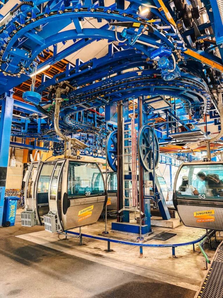 Grindelwald First gondola loading area with modern cable car cabins in the Bernese Oberland