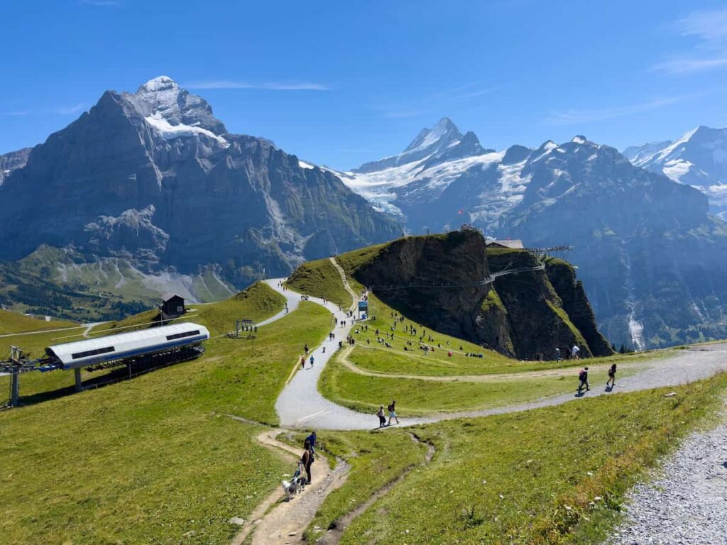 Panoramic view from Grindelwald First with cliff walk, hiking paths and Eiger mountain in the Bernese Oberland