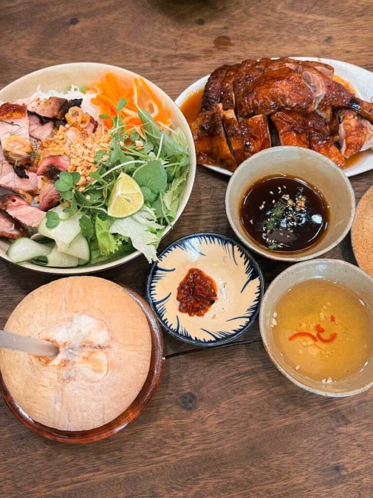 Vietnamese dishes at Com Linh restaurant in Hoi An including noodles, roasted duck, grilled pork, and soup