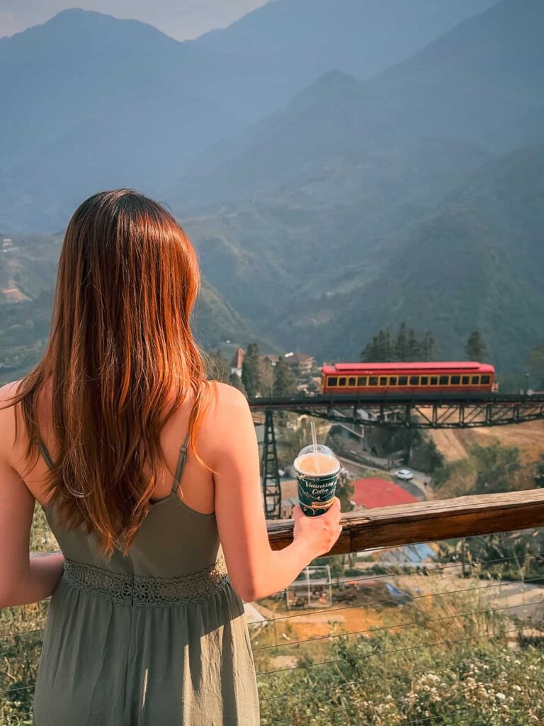 Mountain view from Viettrekking Coffee in Sapa, Vietnam, overlooking the Mường Hoa Mountain Train as it crosses the valley below.