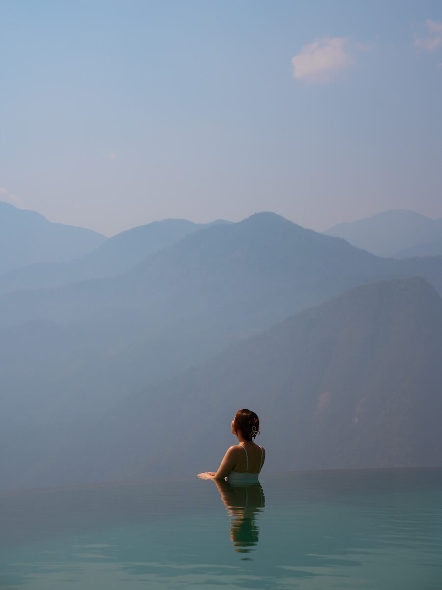 Mountain views from a bungalow balcony at Topas Ecolodge in Sapa