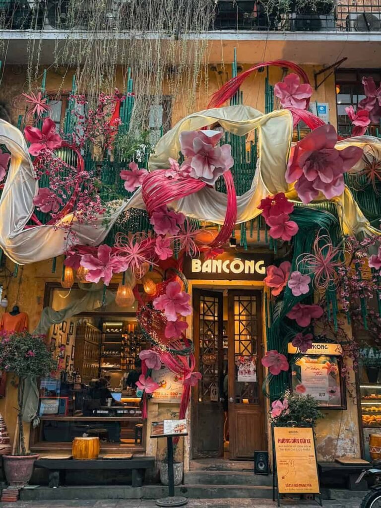 Flower-covered facade of Bancong Cafe in Hanoi's Old Quarter