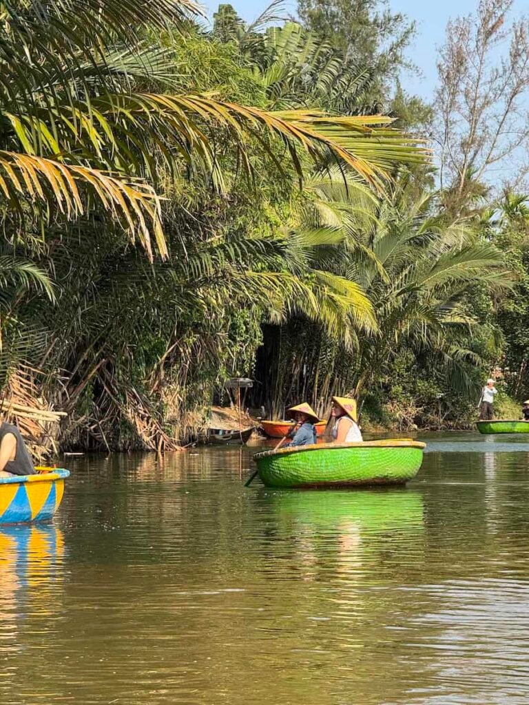 Round woven basket boats in the coconut palm forest near Hoi An