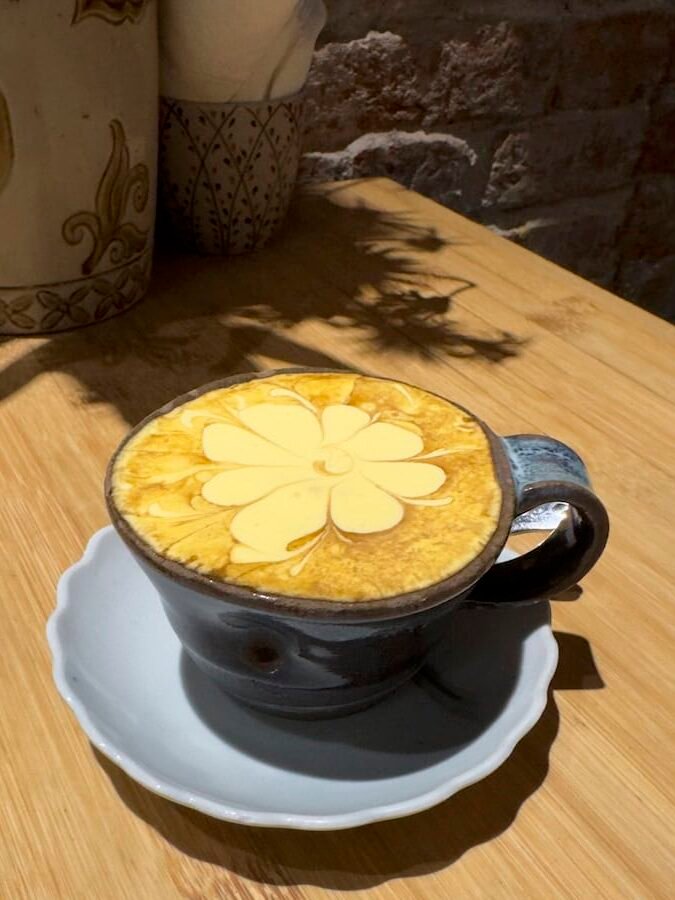 Vietnamese egg coffee topped with thick whipped egg yolk foam in Hanoi