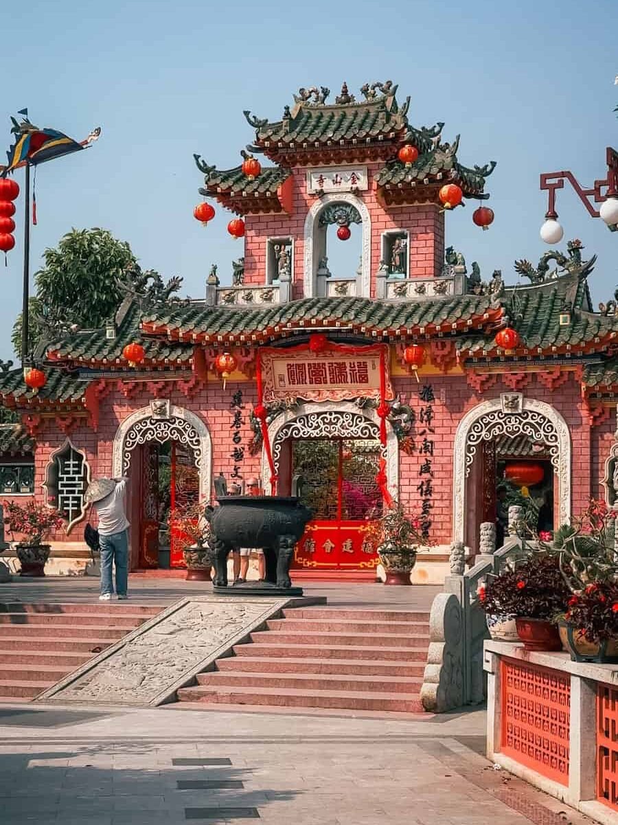 Pink triple-arched gate of the Phuc Kien Assembly Hall in Hoi An