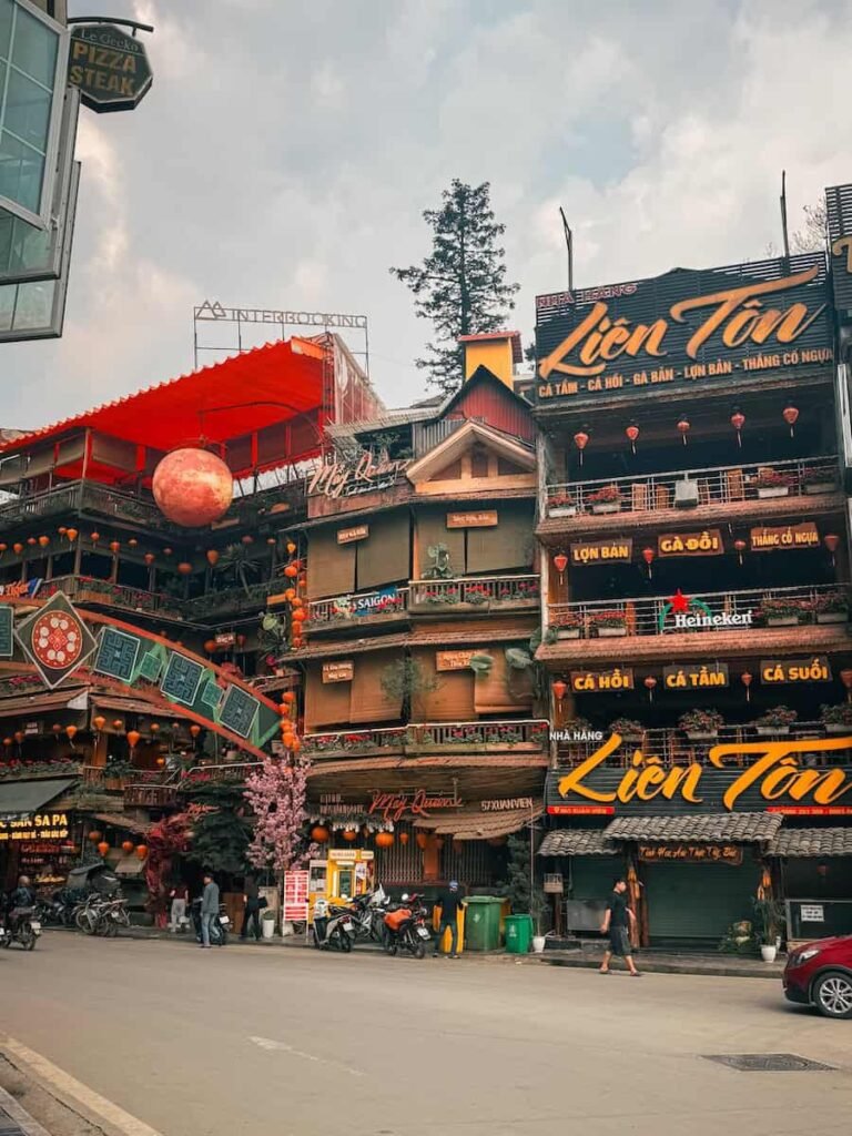 Restaurants and hotels stacked along a street in Sapa town, Vietnam