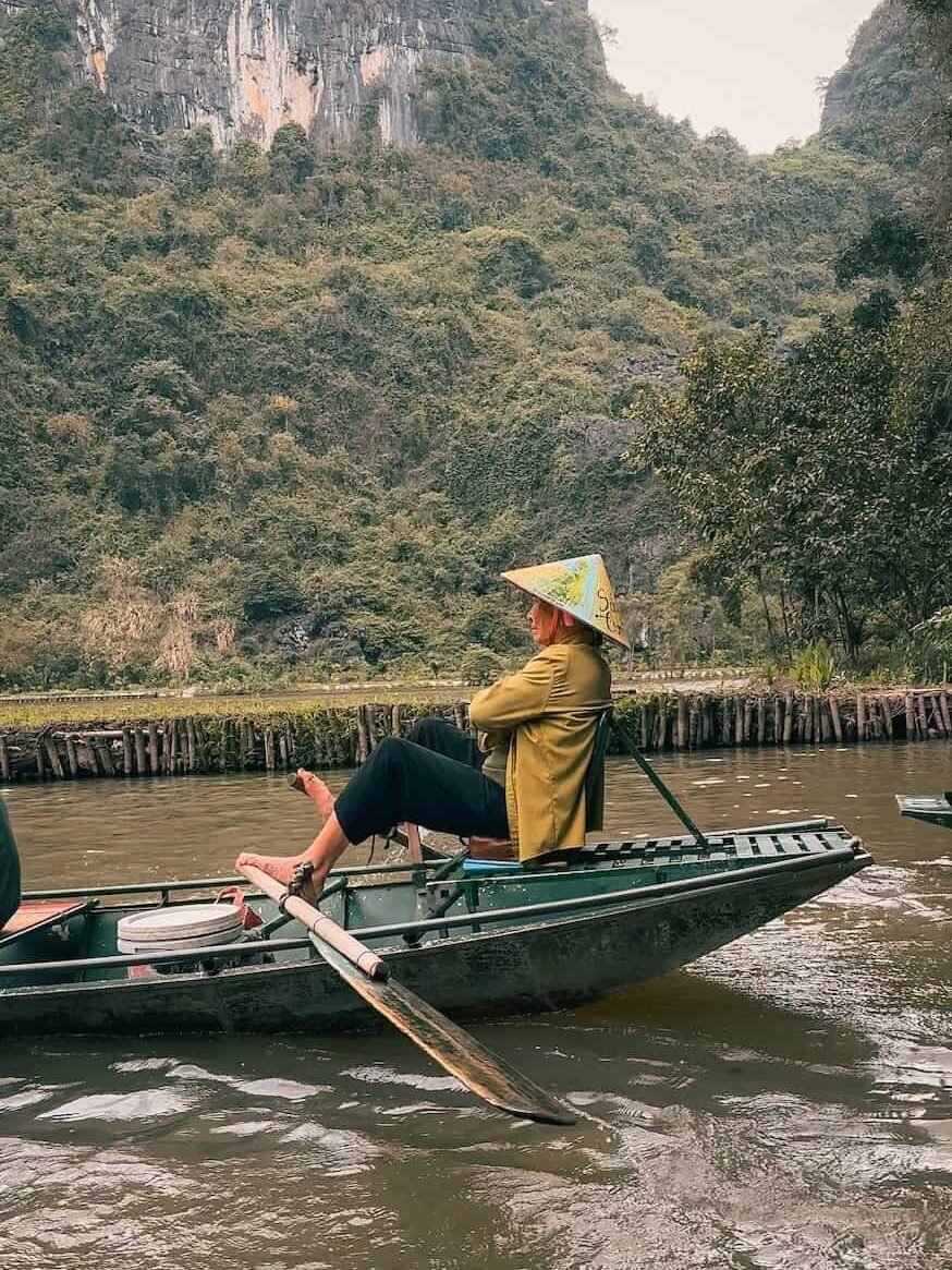 Boat rower at Tam Coc using the traditional foot-rowing technique Ninh Binh is known for