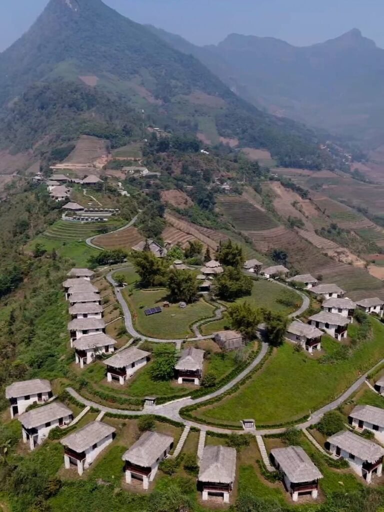 White granite bungalows at Topas Ecolodge overlooking the valleys outside Sapa