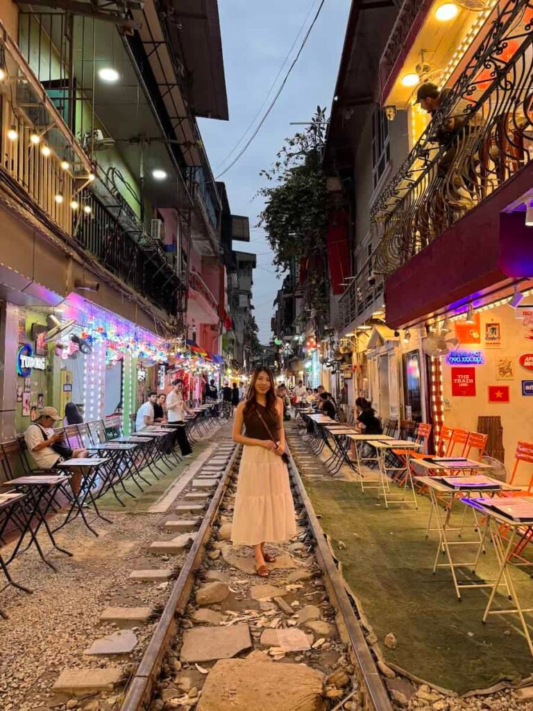 Railway tracks running between narrow houses and cafes on Hanoi's Train Street